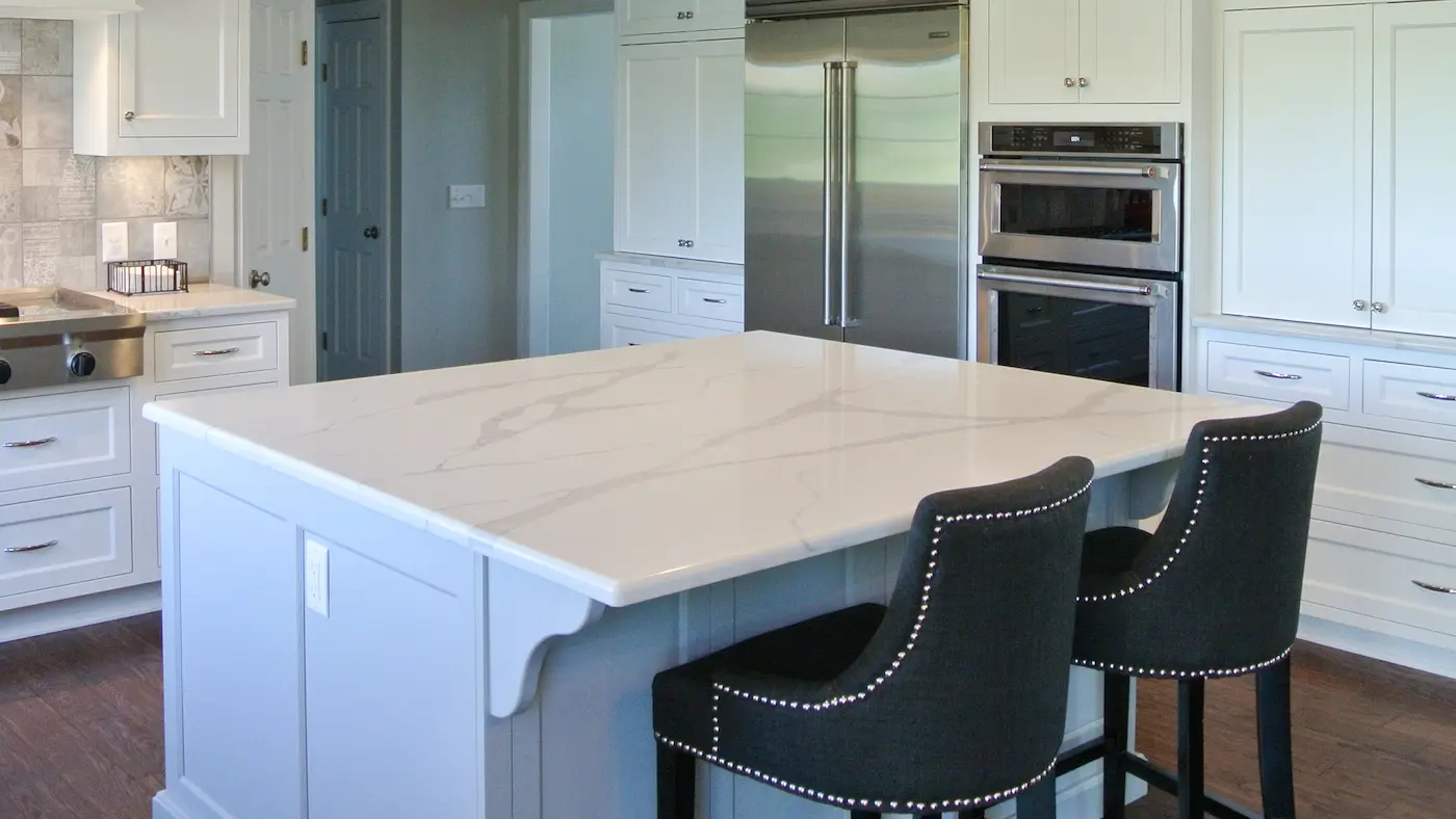 A detailed white countertop on a kitchen island 